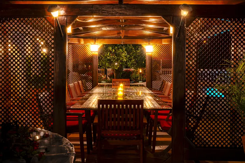 Pergola dining area lit at night at a luxury villa in Adeje Tenerife