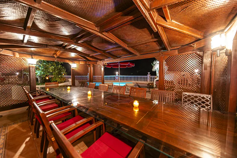 Covered pergola dining table for large groups at Villa Monaco Tenerife