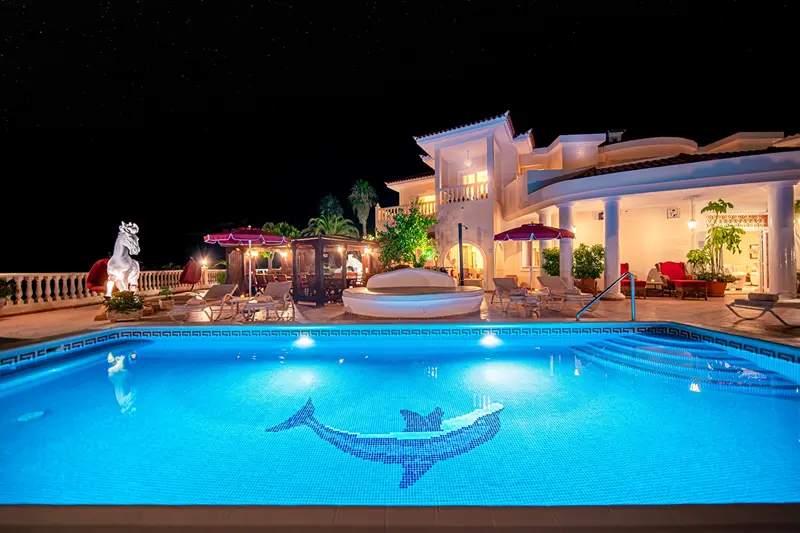 Heated pool and pergola lit at night at Villa Monaco in Adeje Tenerife