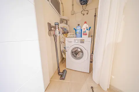 Laundry facilities in apartment bathroom at Villa Monaco Adeje Tenerife
