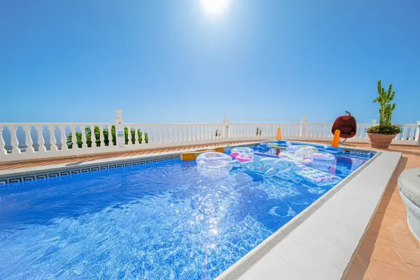 Heated pool and sun terrace at Villa Monaco Adeje Tenerife with panoramic sea views