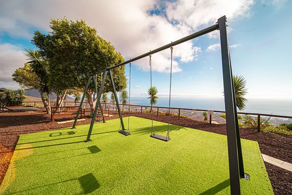 Garden leisure area with swings and petanque at Villa Monaco Adeje Tenerife